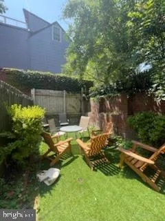 a view of a backyard with plants and lake