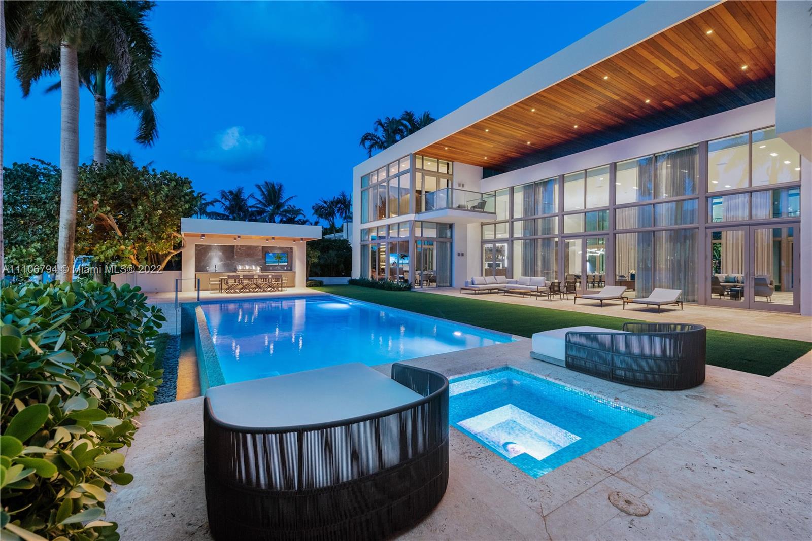 6396 North Bay Road Miami Beach, FL 33140 - Photo 12 of 12 a view of a house with pool and sitting area