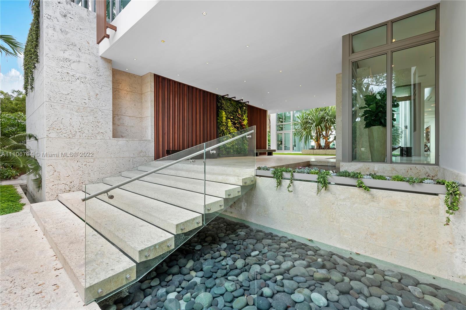 6396 North Bay Road Miami Beach, FL 33140 - Photo 9 of 12 a swimming pool with outdoor seating and yard