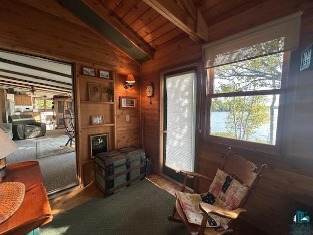 2734 Bear Island River Road Ely, MN 55731 - Photo 13 of 37 Living area featuring wooden walls, wood ceiling, and a water view