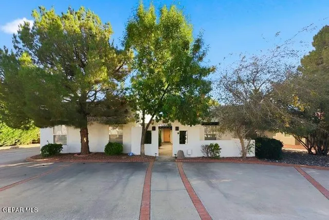 a view of a road with a building in the background