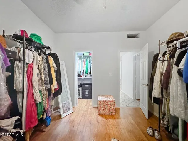 a bathroom with a toilet a sink and a mirror