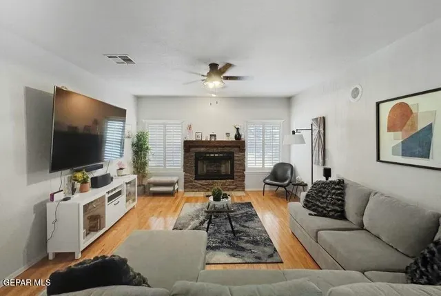 a living room with furniture and a fireplace