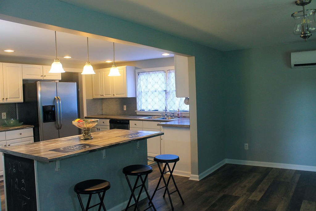 288 Clubbs Road Portland, TN 37148 - Photo 14 of 48 a kitchen with a sink cabinets and wooden floor