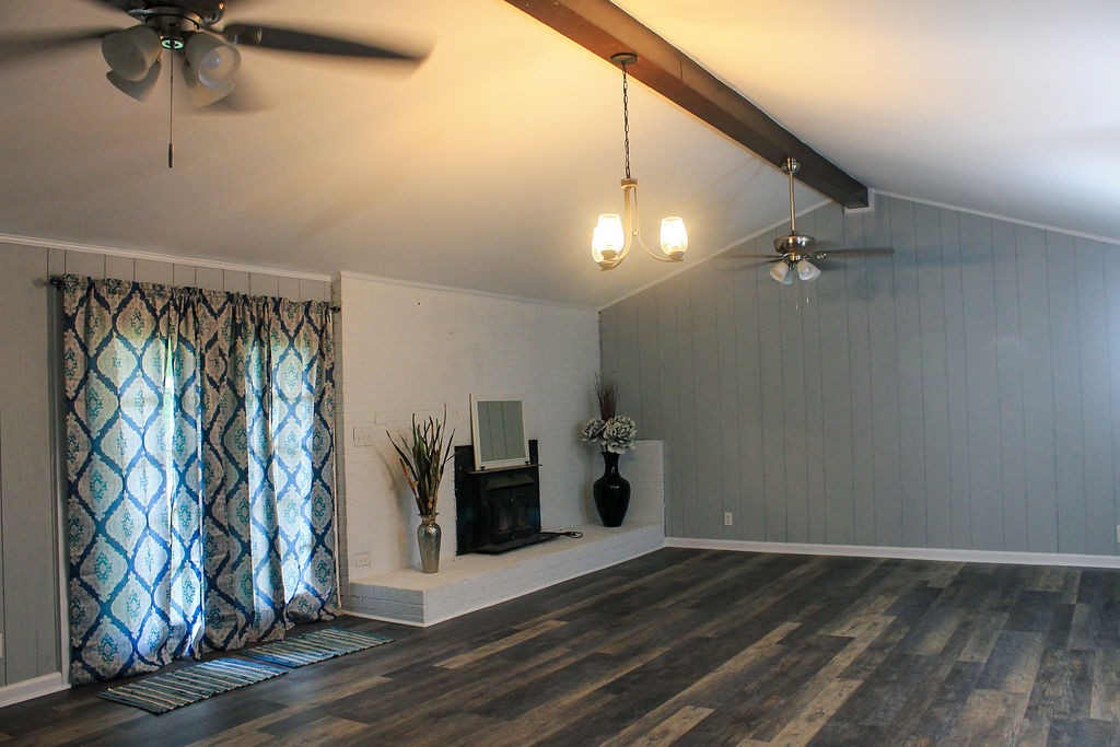 288 Clubbs Road Portland, TN 37148 - Photo 30 of 48 a view of a livingroom with wooden floor and a ceiling fan