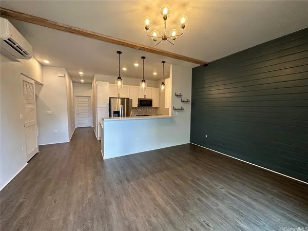 a view of a kitchen with a sink and wooden floor