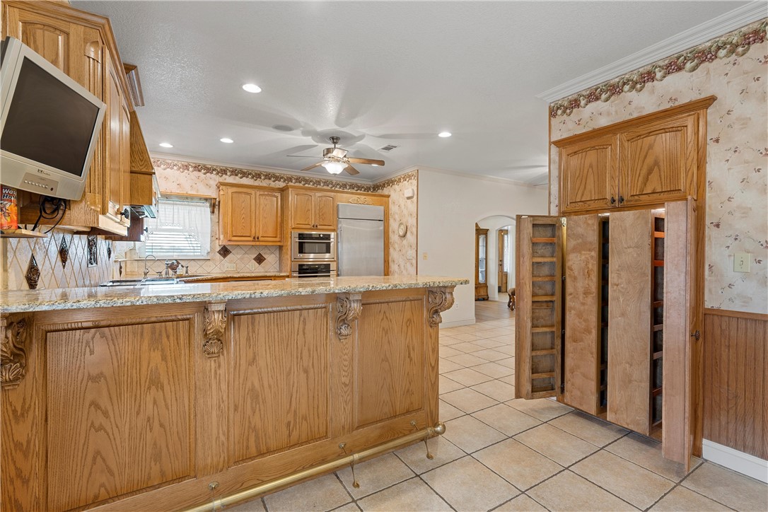 113 Cr 453 Road Troy, TX 76579 - Photo 12 of 41 a kitchen with stainless steel appliances granite countertop a refrigerator and a sink