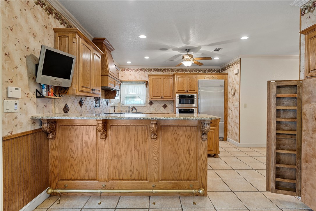 113 Cr 453 Road Troy, TX 76579 - Photo 13 of 41 a kitchen with stainless steel appliances kitchen island granite countertop a refrigerator oven a sink and dishwasher
