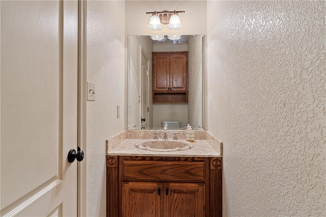 113 Cr 453 Road Troy, TX 76579 - Photo 15 of 41 a bathroom with a sink and a mirror