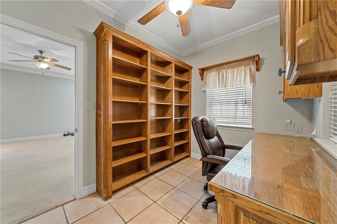 113 Cr 453 Road Troy, TX 76579 - Photo 16 of 41 a view of a workspace with furniture and a window