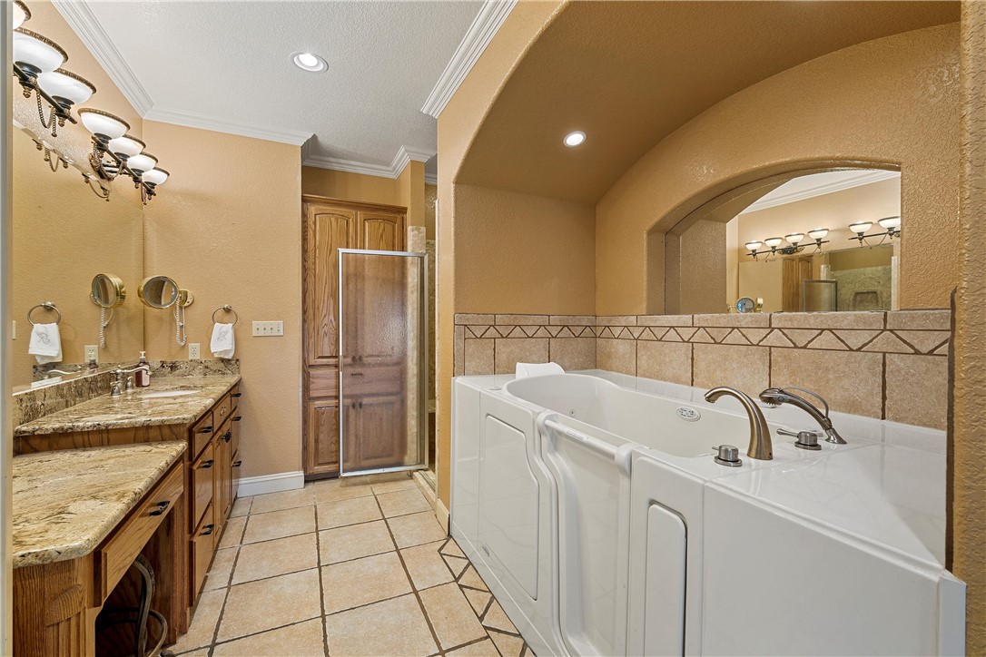 113 Cr 453 Road Troy, TX 76579 - Photo 19 of 41 a bathroom with a sink a vanity and a mirror