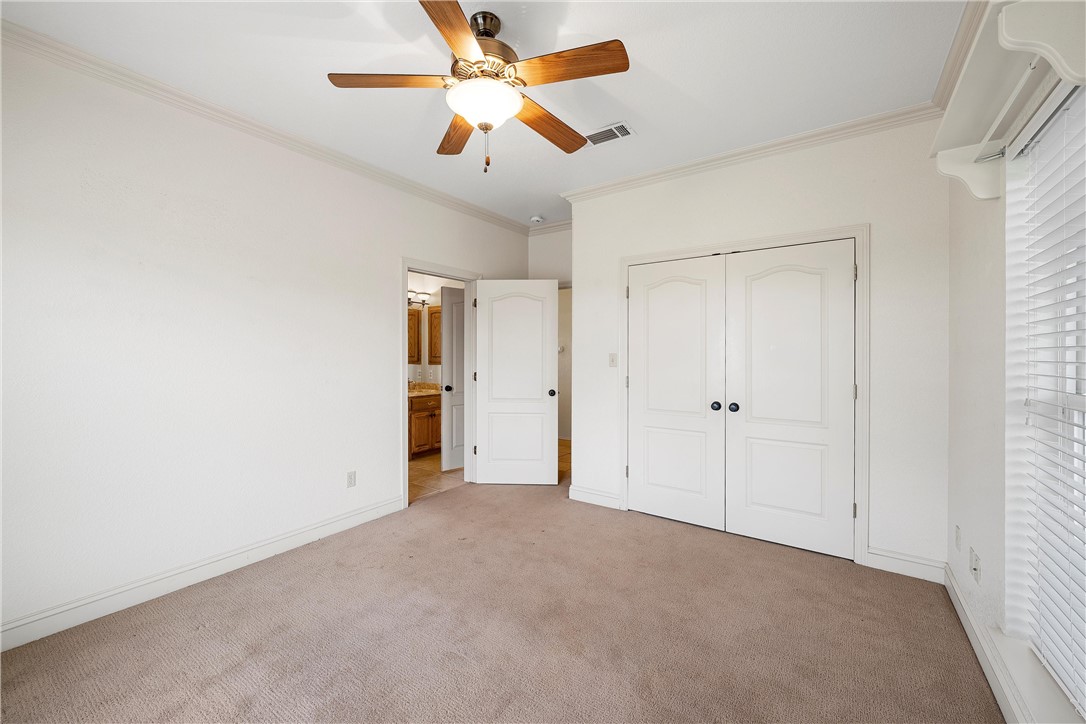 113 Cr 453 Road Troy, TX 76579 - Photo 23 of 41 an empty room with closet and a ceiling fan