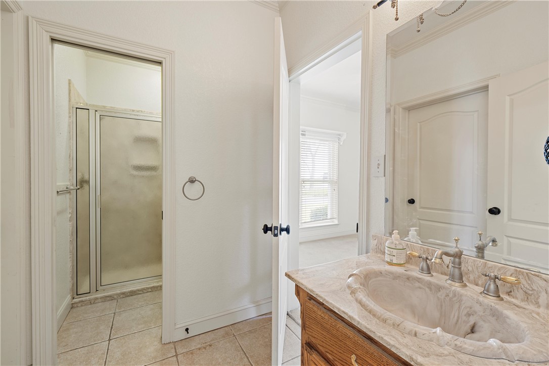 113 Cr 453 Road Troy, TX 76579 - Photo 24 of 41 a bathroom with a sink and a mirror