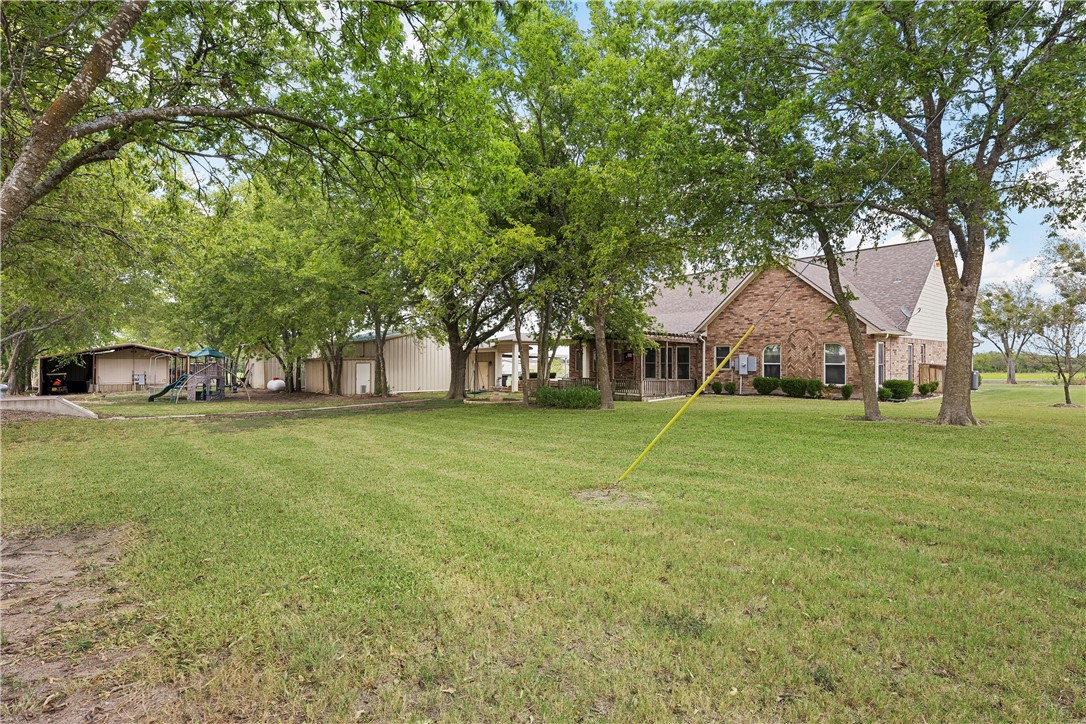 113 Cr 453 Road Troy, TX 76579 - Photo 30 of 41 a view of a house with a yard