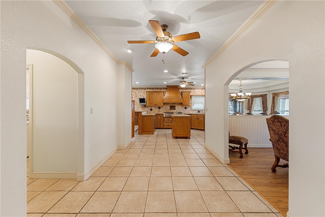 113 Cr 453 Road Troy, TX 76579 - Photo 9 of 41 a view of a living room and kitchen with furniture and a ceiling fan