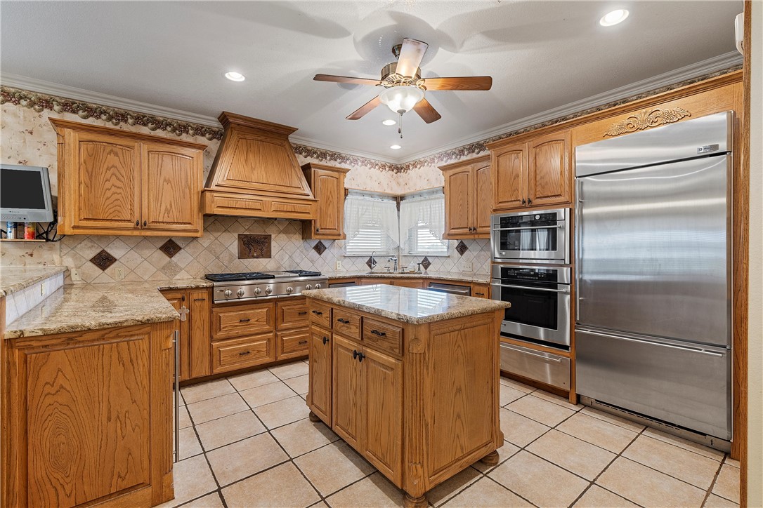113 Cr 453 Road Troy, TX 76579 - Photo 10 of 41 a kitchen with kitchen island granite countertop a sink appliances cabinets and a counter top space