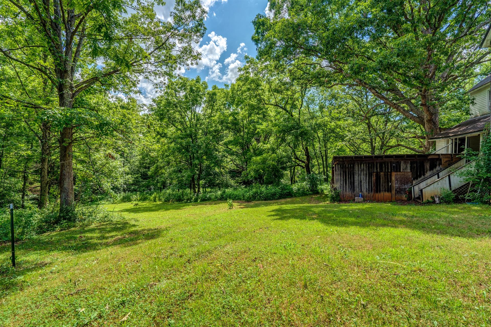 6051 Ferrum Mountain Road Callaway, VA 24067 - Photo 2 of 14 a view of a trees in a yard