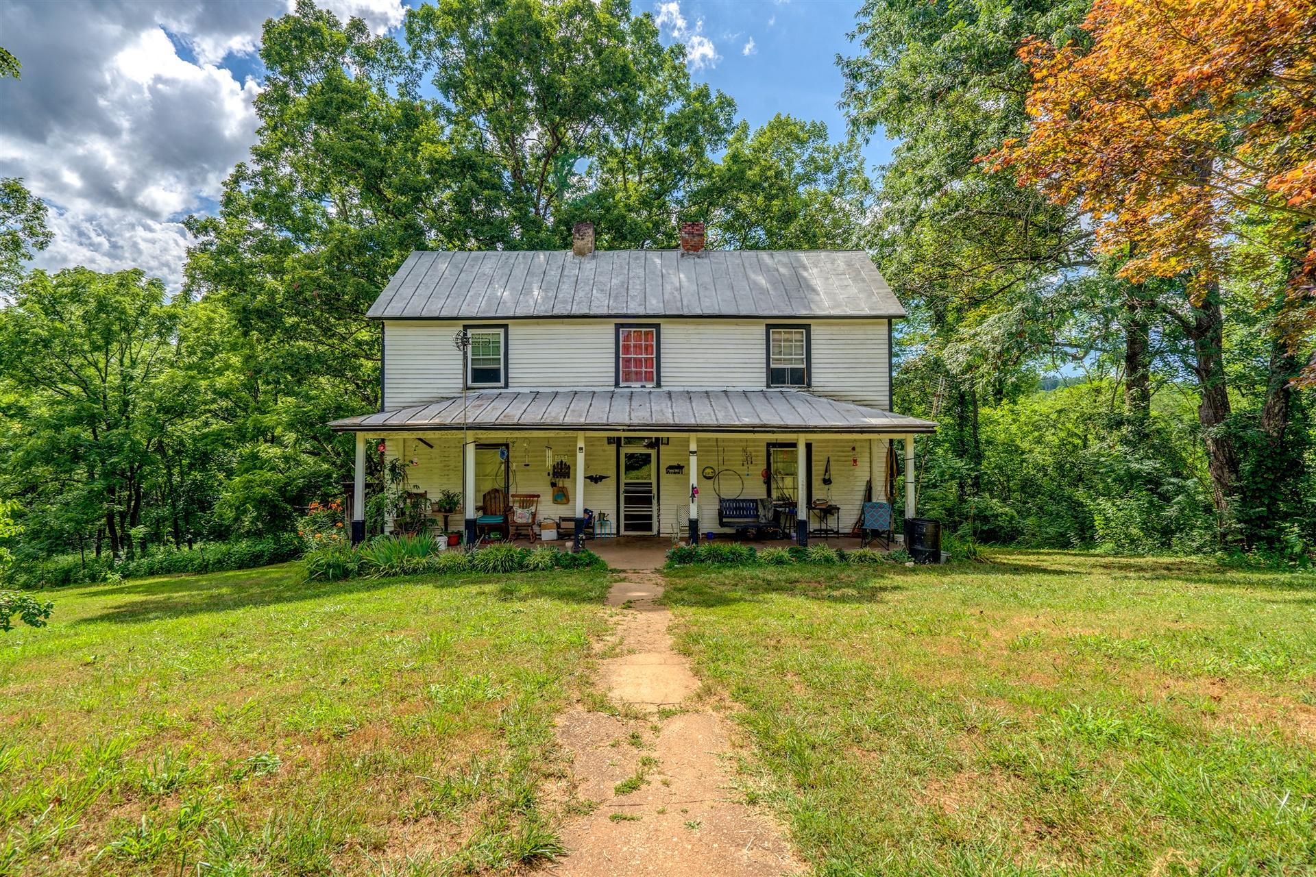6051 Ferrum Mountain Road Callaway, VA 24067 - Photo 14 of 14 a view of a house with backyard and sitting area