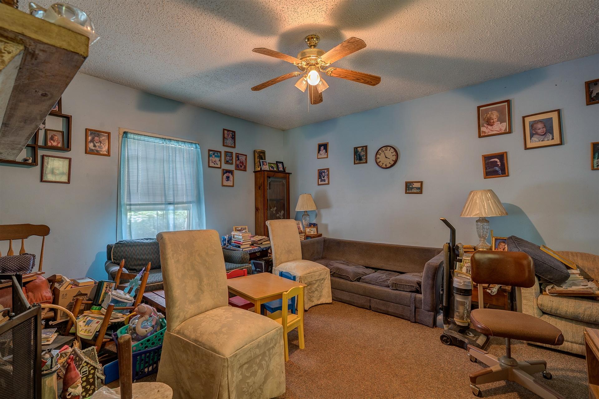 6051 Ferrum Mountain Road Callaway, VA 24067 - Photo 9 of 14 a living room with furniture and a flat screen tv