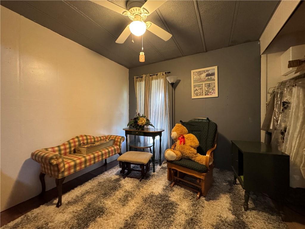 60 Carl Avenue, Unit 2 Eighty Four, PA 15330 - Photo 11 of 15 a bedroom with furniture and a lamp