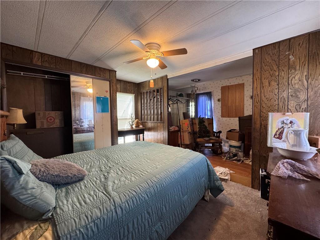 60 Carl Avenue, Unit 2 Eighty Four, PA 15330 - Photo 13 of 15 a spacious bedroom with a bed a dresser and potted plant