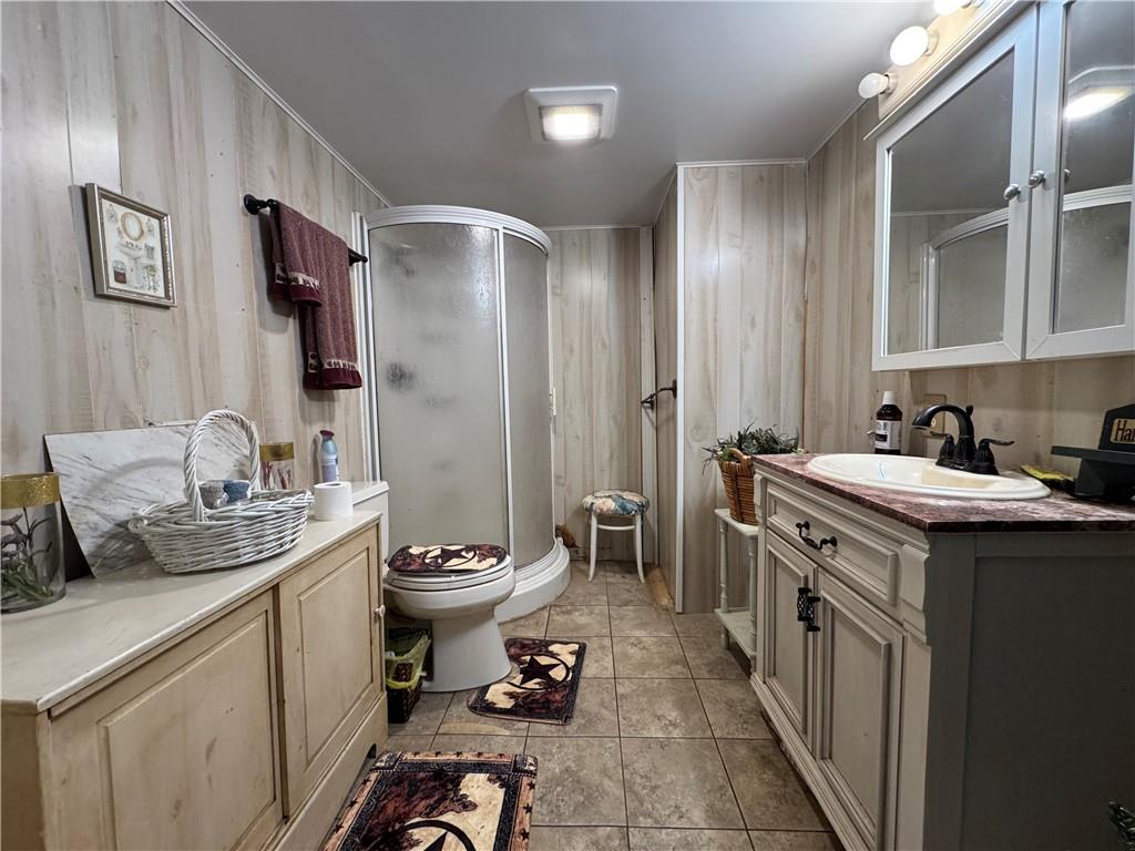 60 Carl Avenue, Unit 2 Eighty Four, PA 15330 - Photo 14 of 15 a bathroom with a double vanity sink toilet and mirror