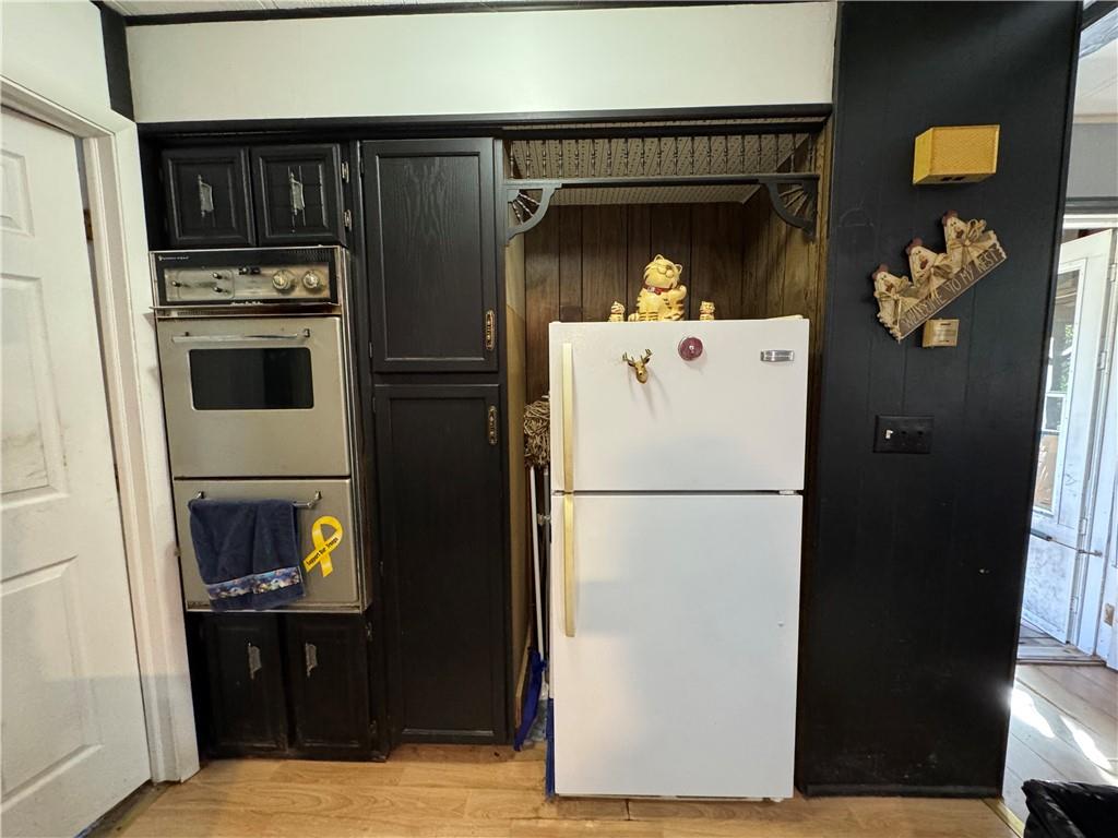 60 Carl Avenue, Unit 2 Eighty Four, PA 15330 - Photo 10 of 15 a white refrigerator freezer and a stove sitting inside of a kitchen