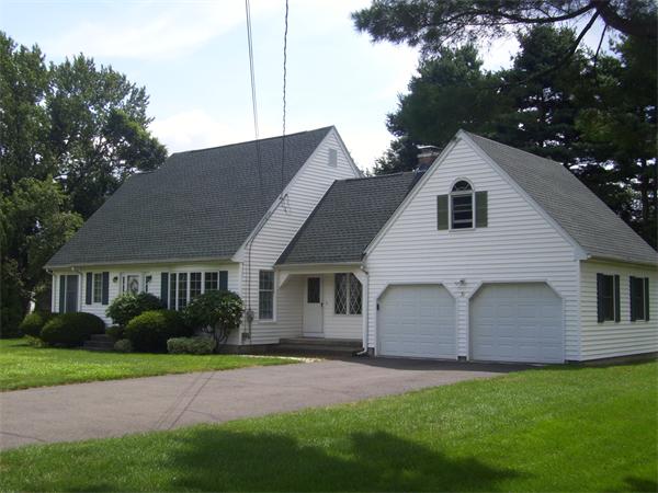 31 Bear Hole Road West Springfield, MA 01089 - Photo 2 of 14 a front view of a house with a garden and yard