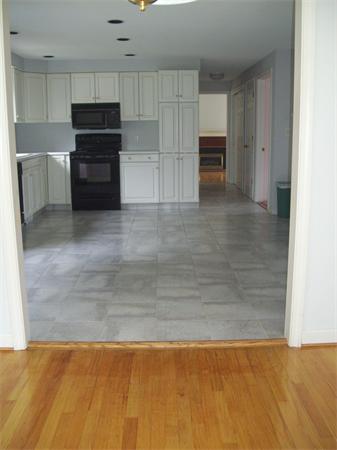 31 Bear Hole Road West Springfield, MA 01089 - Photo 4 of 14 a view of a kitchen with refrigerator and cabinet