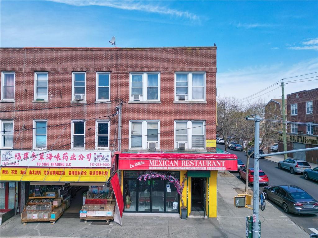 a cafe on the corner of a building