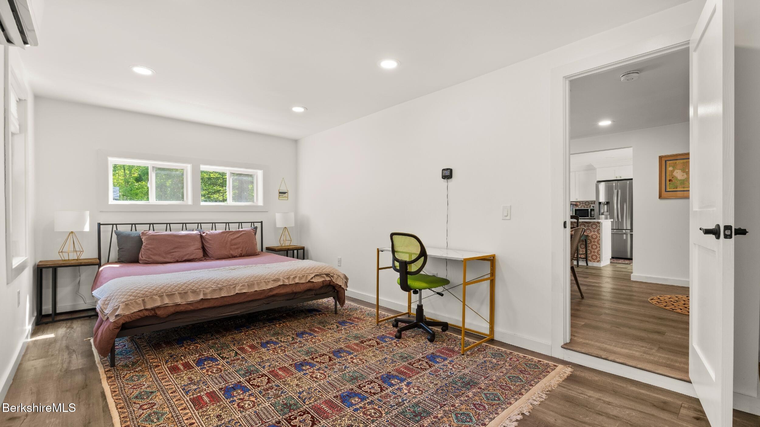 418 Monterey Road Great Barrington, MA 01230 - Photo 13 of 28 a bedroom with a bed a rug and a window