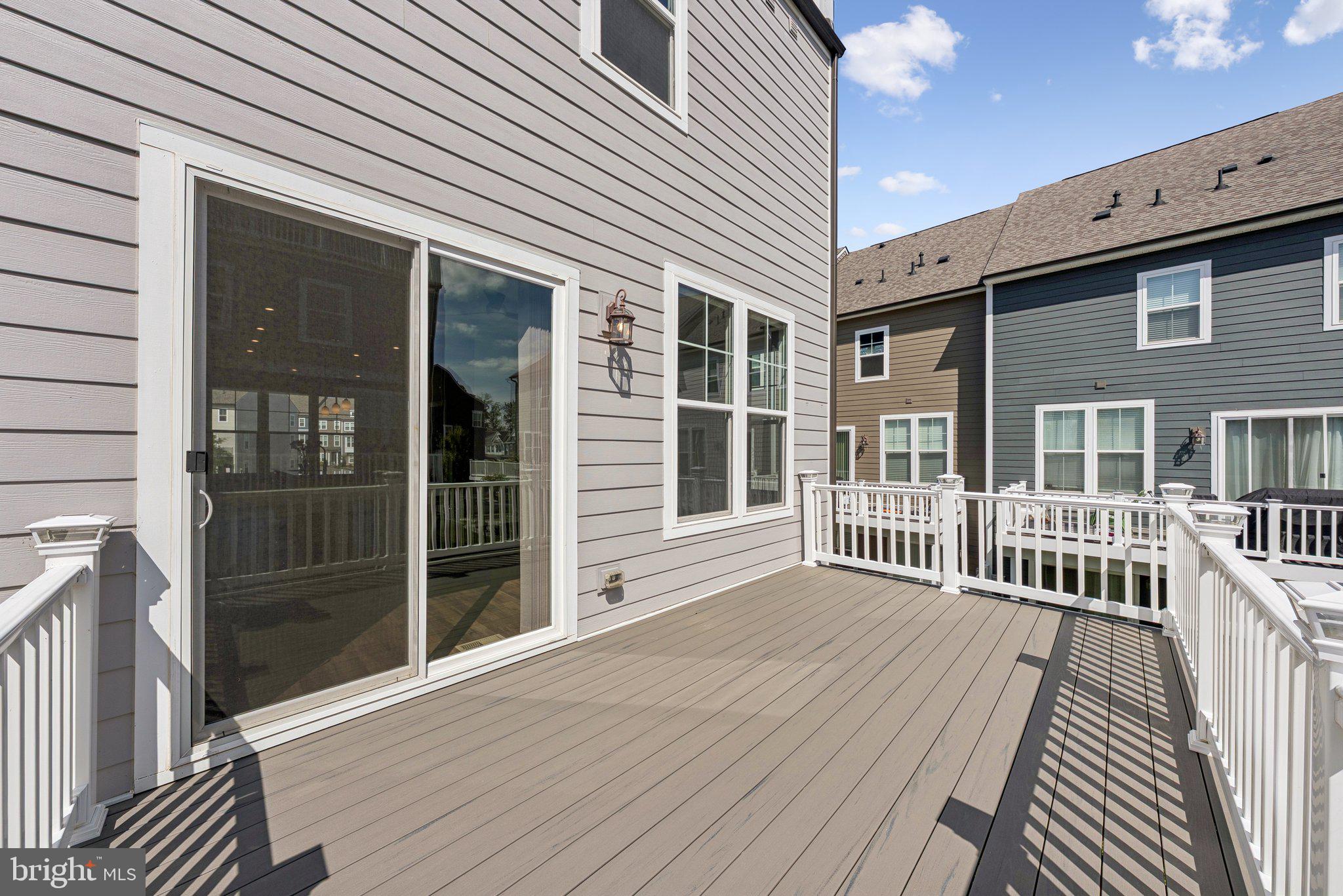 1655 Aspen Poplar Road Dumfries, VA 22026 - Photo 11 of 57 a view of a house with wooden deck