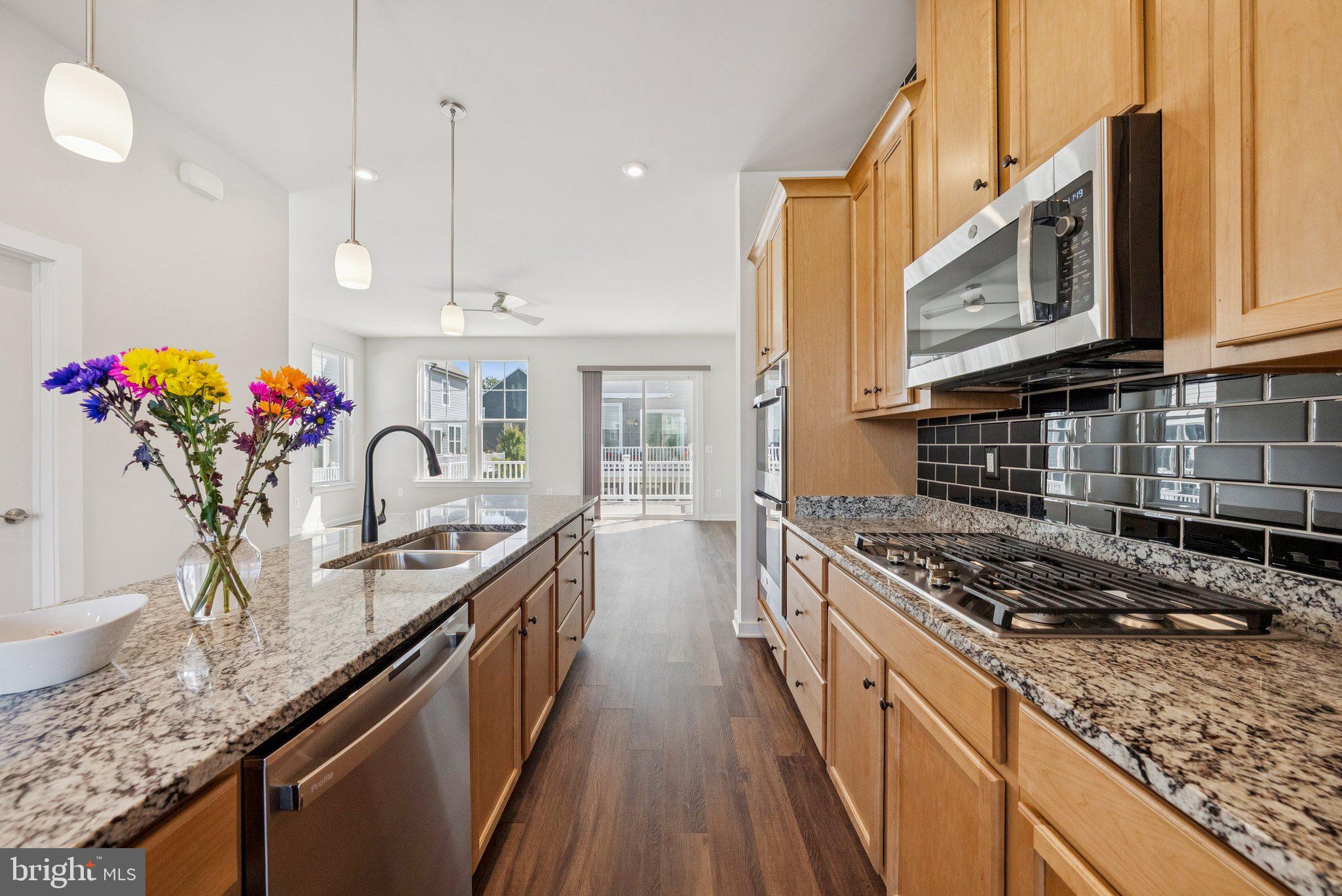 1655 Aspen Poplar Road Dumfries, VA 22026 - Photo 16 of 57 a kitchen with sink stove and cabinets