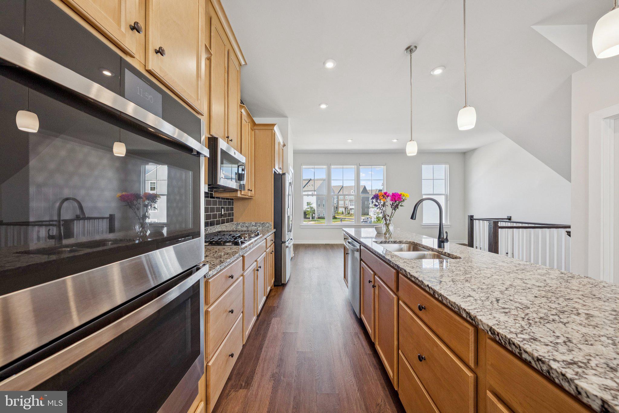 1655 Aspen Poplar Road Dumfries, VA 22026 - Photo 17 of 57 a large kitchen with granite countertop lots of counter space and a sink
