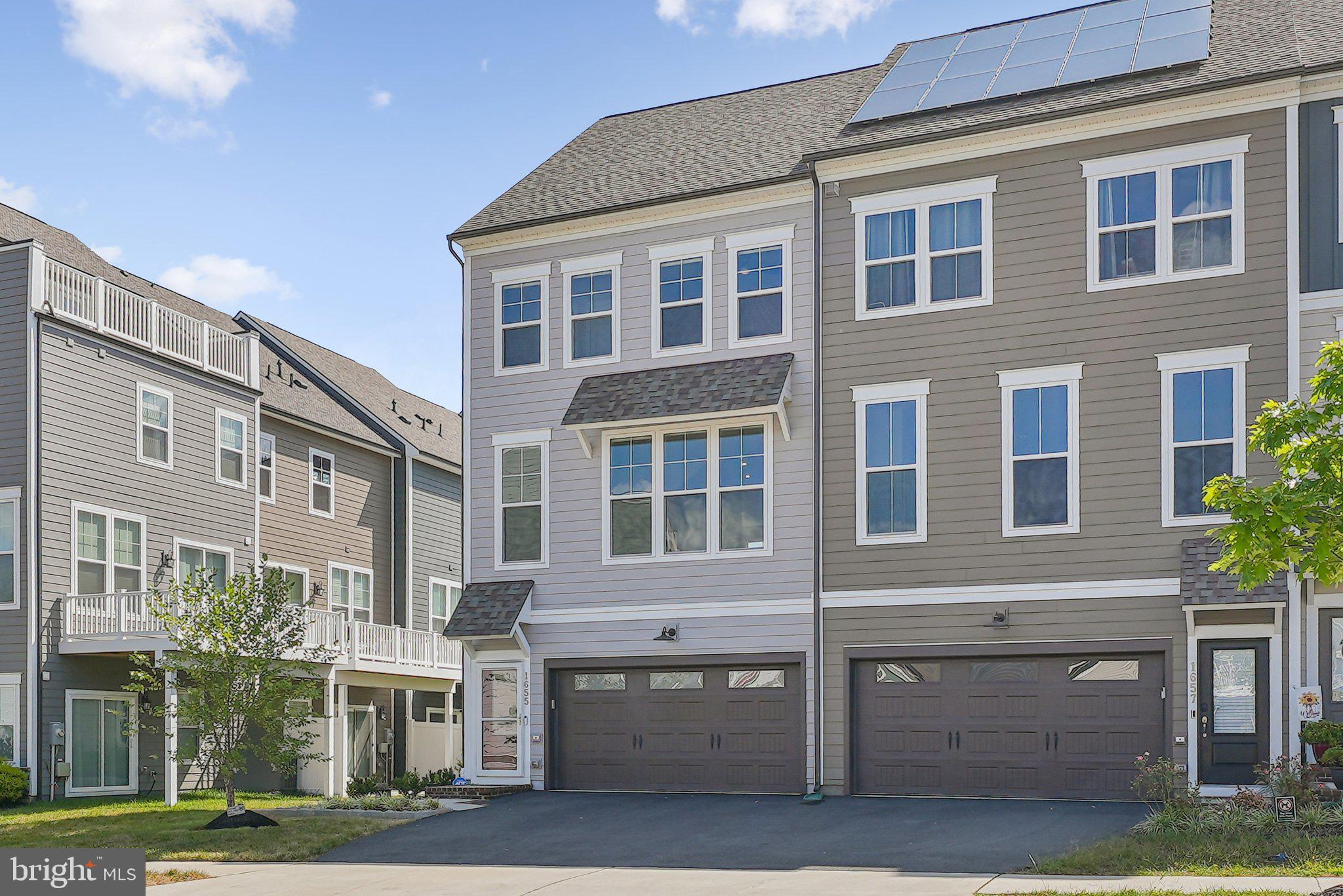 1655 Aspen Poplar Road Dumfries, VA 22026 - Photo 2 of 57 a front view of a building with a garden and plants
