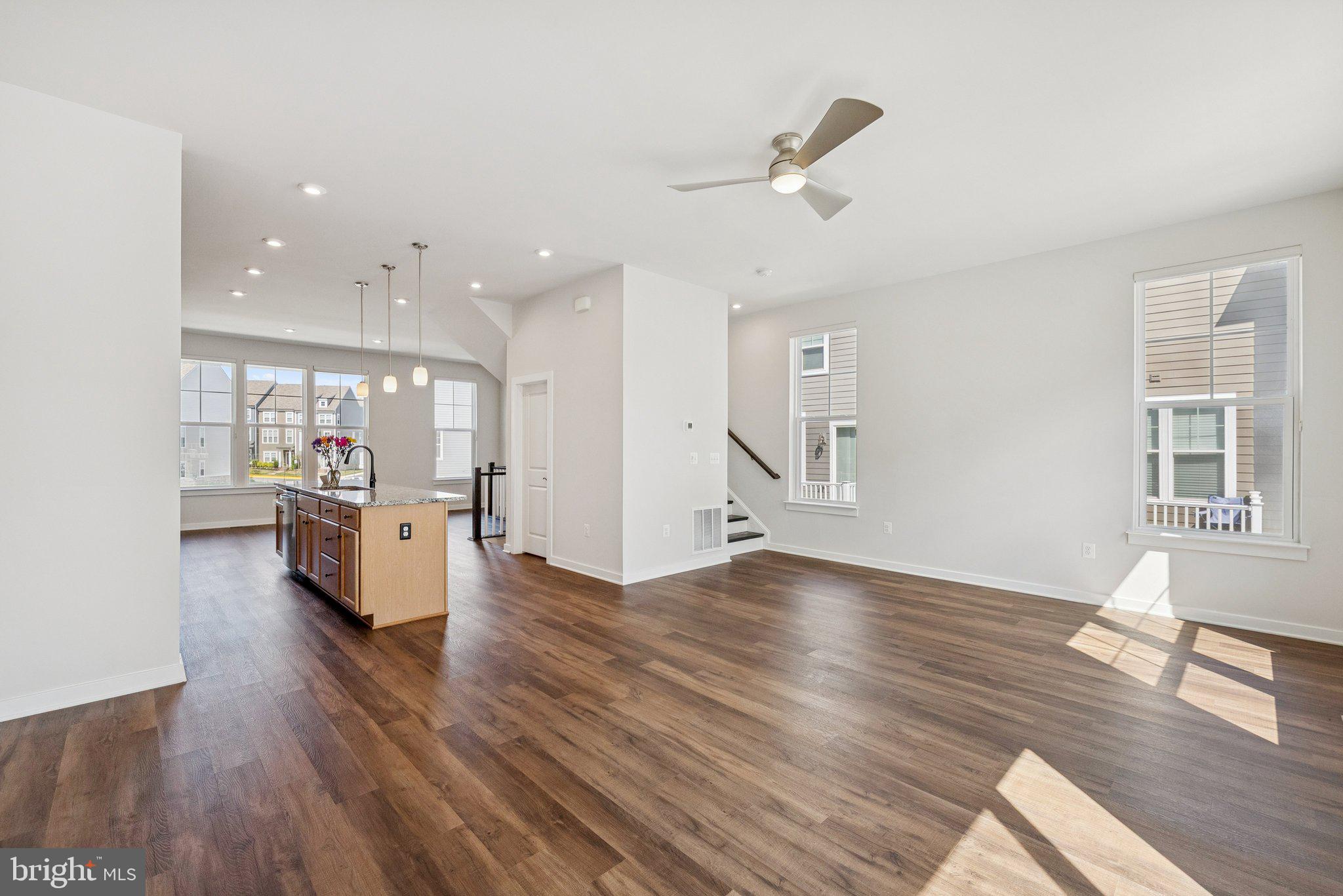 1655 Aspen Poplar Road Dumfries, VA 22026 - Photo 52 of 57 a view of a living room and kitchen with wooden floor