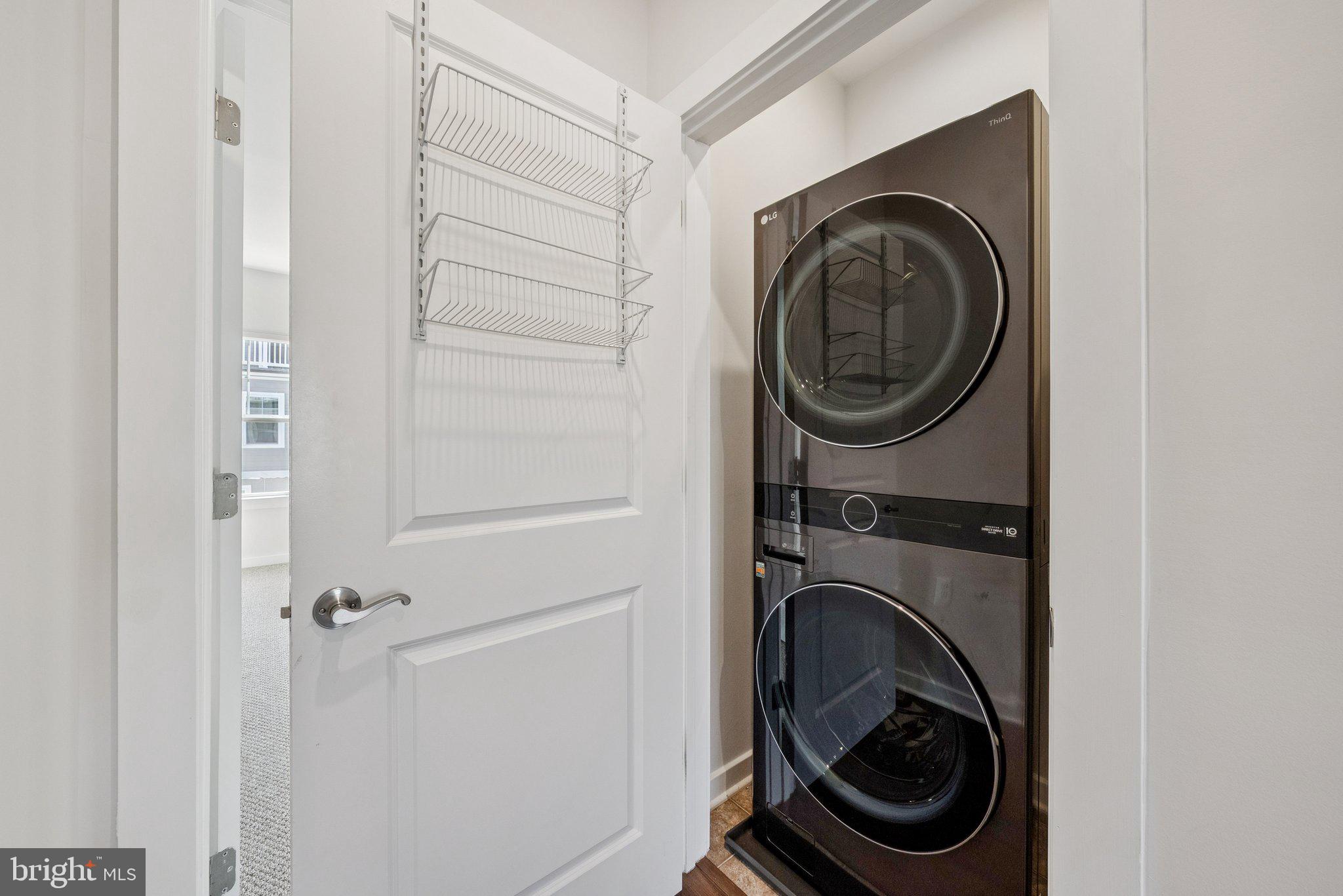 1655 Aspen Poplar Road Dumfries, VA 22026 - Photo 22 of 57 a view of a hallway with washer and dryer