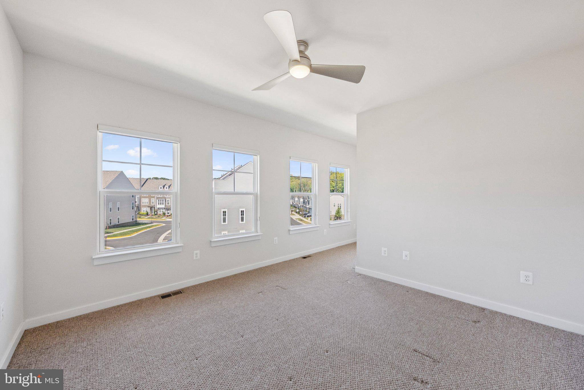 1655 Aspen Poplar Road Dumfries, VA 22026 - Photo 23 of 57 an empty room with windows and ceiling fan