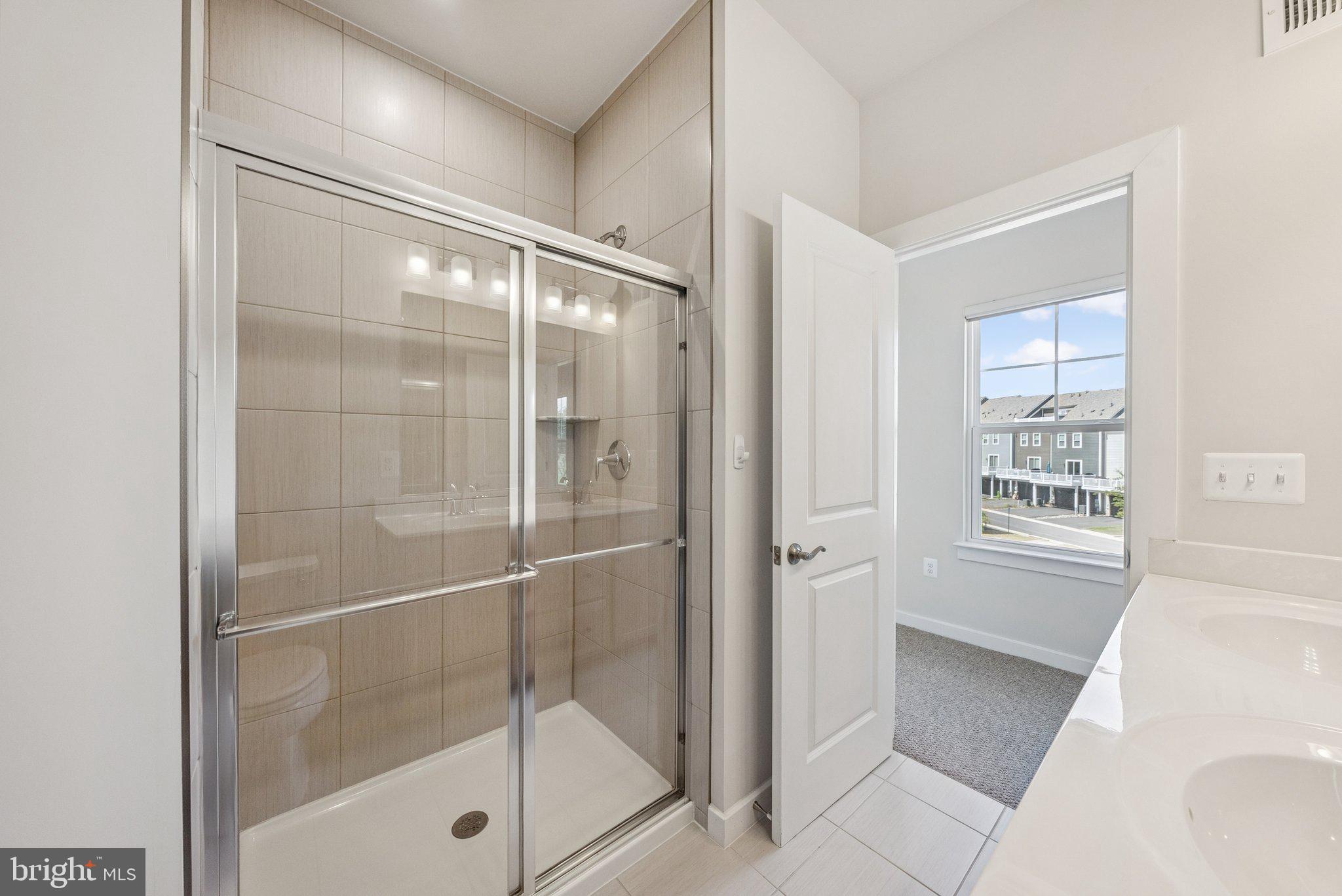 1655 Aspen Poplar Road Dumfries, VA 22026 - Photo 27 of 57 a bathroom with a bathtub and a shower