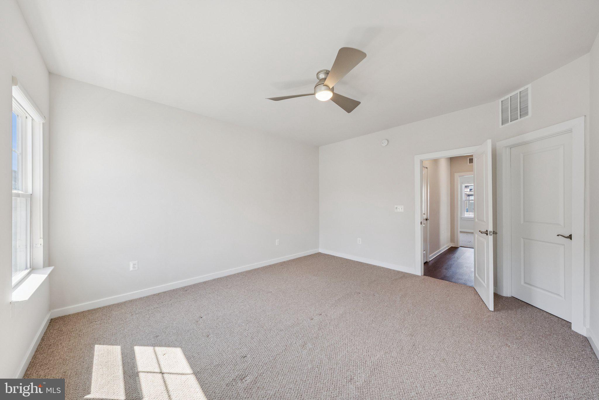 1655 Aspen Poplar Road Dumfries, VA 22026 - Photo 30 of 57 wooden floor in an empty room with a window