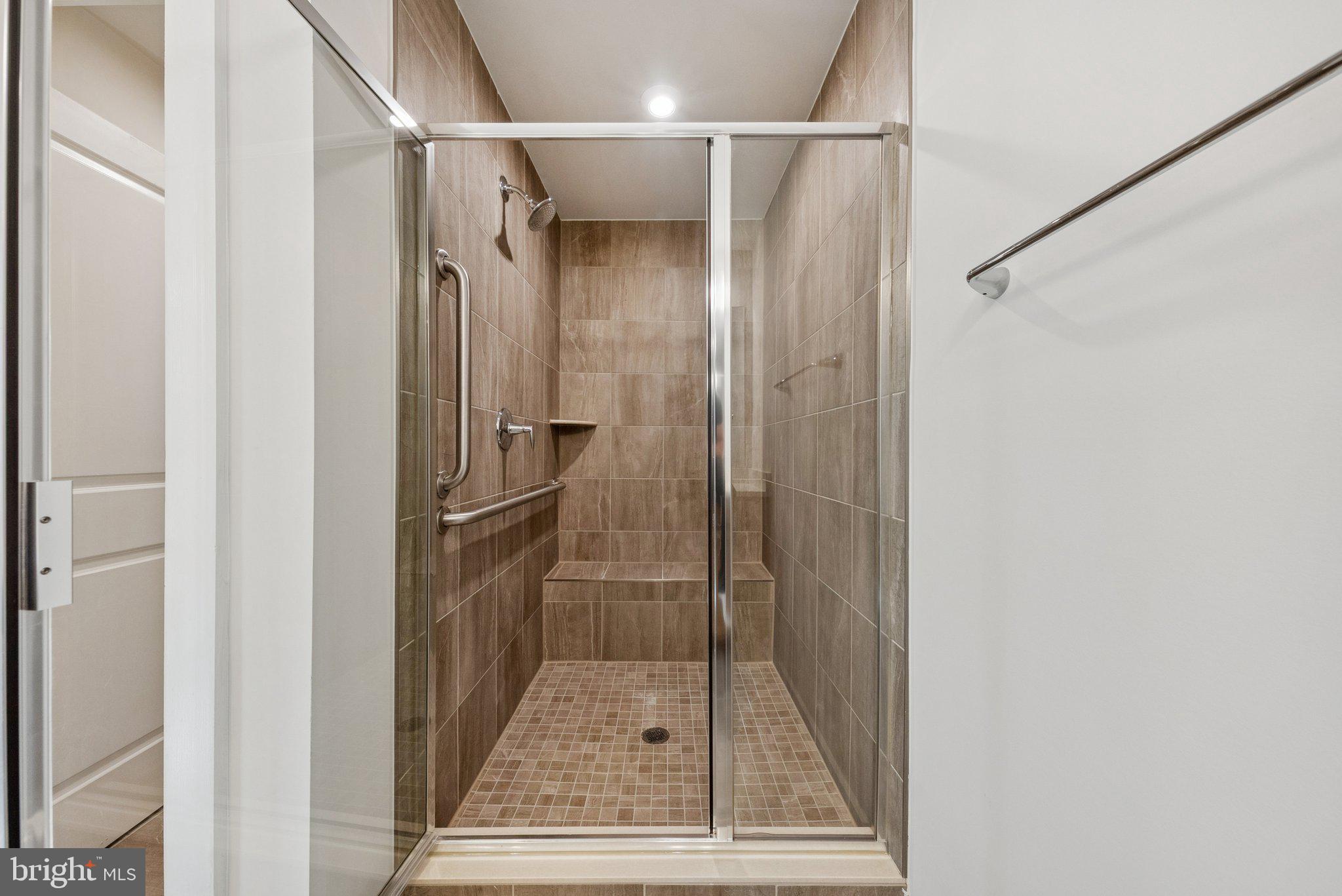 1655 Aspen Poplar Road Dumfries, VA 22026 - Photo 32 of 57 a bathroom with a glass shower door