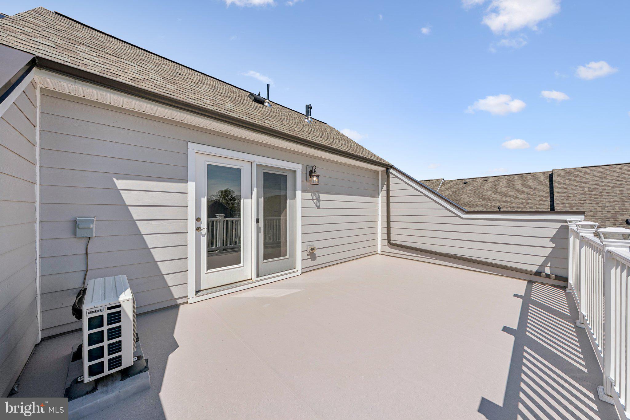 1655 Aspen Poplar Road Dumfries, VA 22026 - Photo 38 of 57 a view of a patio with table and chairs with wooden floor and fence