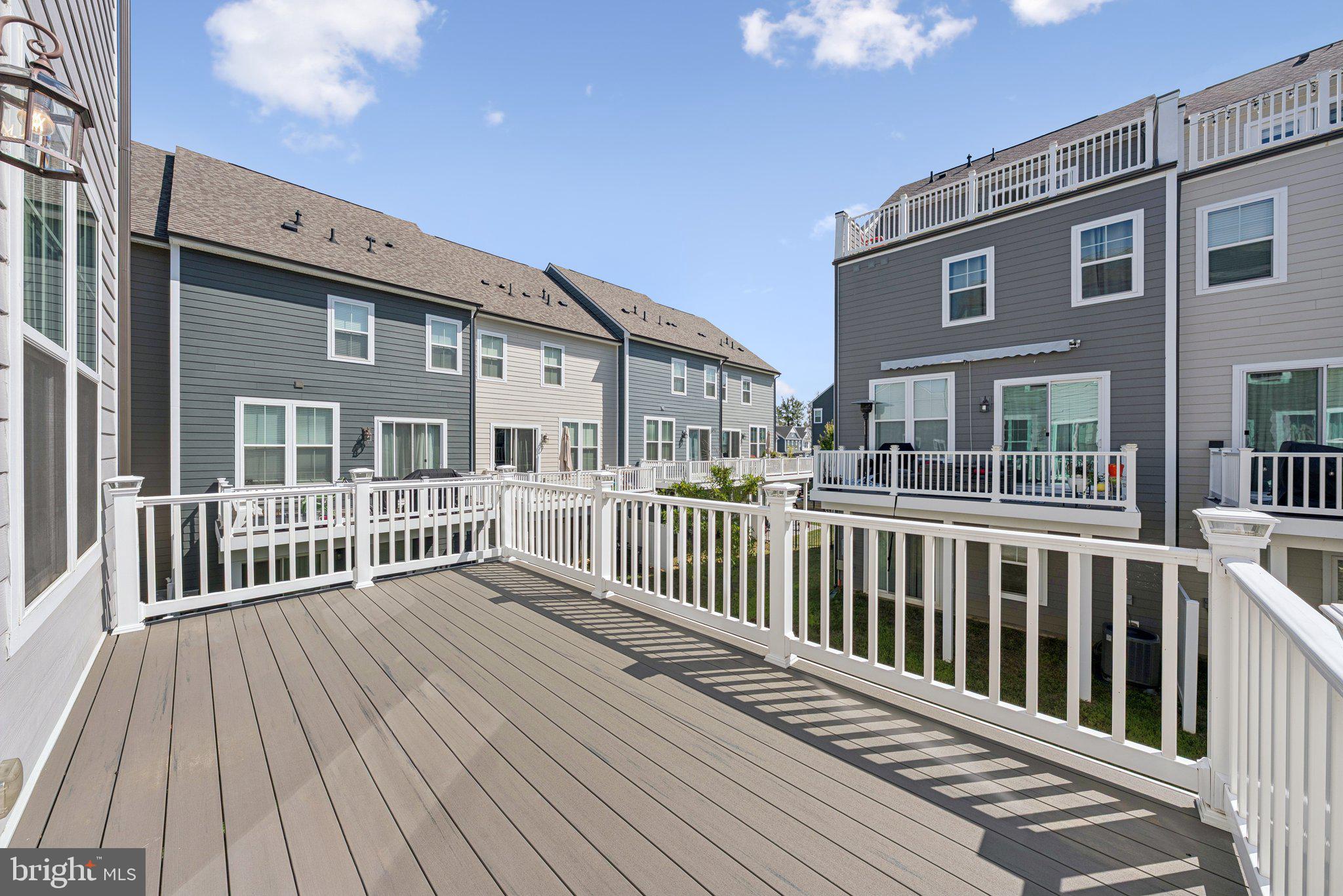 1655 Aspen Poplar Road Dumfries, VA 22026 - Photo 10 of 57 a view of a wooden deck and a yard