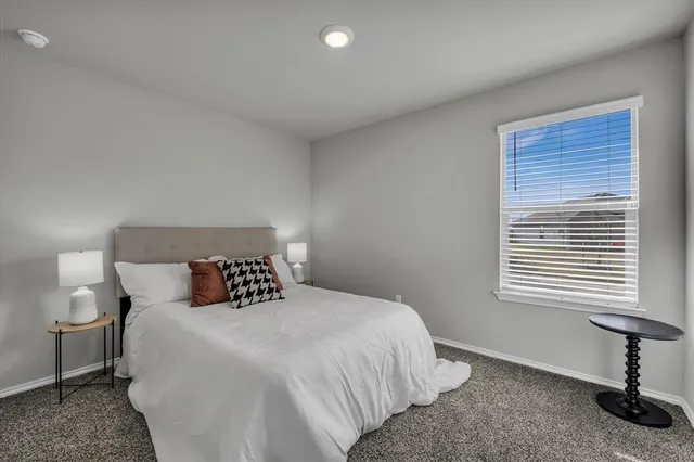 a bathroom with a toilet sink and shower