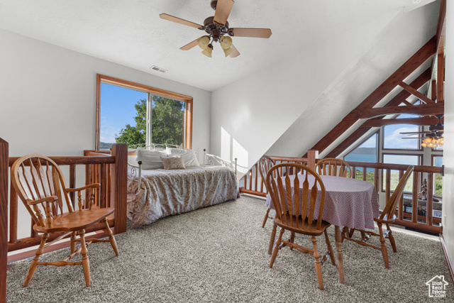 1340 Trapper Loop Garden City, UT 84028 - Photo 19 of 35 Bedroom featuring carpet, lofted ceiling, and a ceiling fan