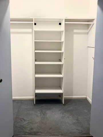 a view of room with racks on the wall