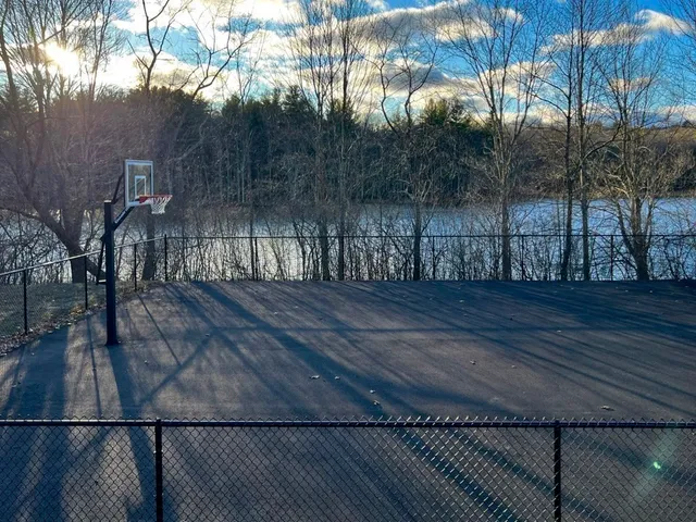 a view of outdoor space and deck with wooden floor