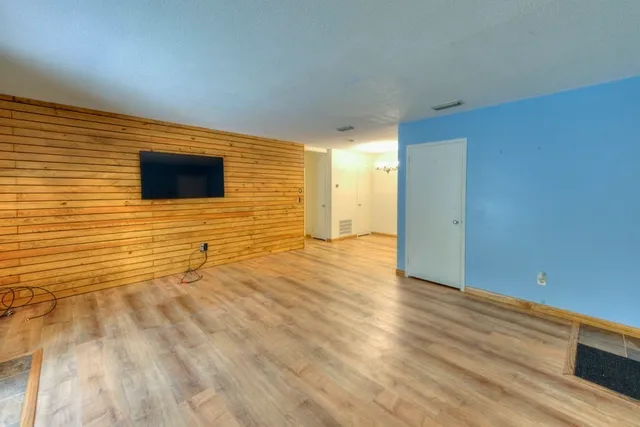 a view of a livingroom with wooden floor
