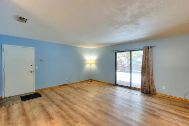 a view of an empty room and window