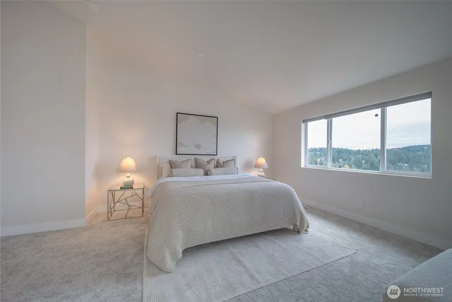 a large bathroom with a granite countertop sink mirror and shower